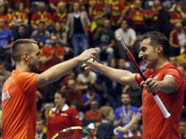 Serbia's Nenad Zimonjic, right, and his partner Viktor Troicki celebrate after winning their Davis Cup quarter-final. AP