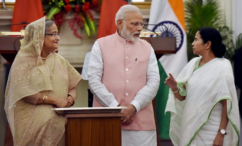 Prime Minister Narendra Modi with his Bangladeshi counterpart Sheikh Hasina and West Bengal CM Mamata Banerjee in New Delhi on Saturday. PTI