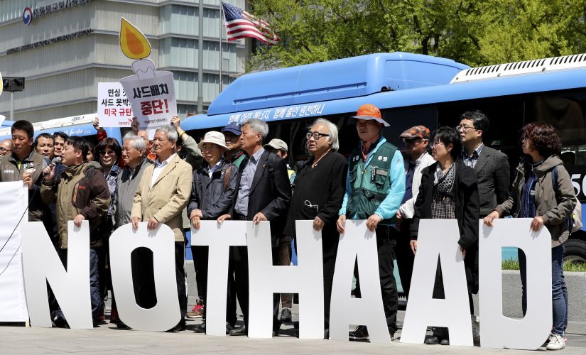 Protesters hold letters reading "NO THAAD" during a rally to oppose a plan to deploy an advanced US missile defense system called Terminal High-Altitude Area Defense, or THAAD, near US Embassy in Seoul. AP