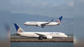 FAA bans American carriers from operating in Tehran-controlled airspace due to 'heightened military activities'; United Airlines suspends NY/Newark-Mumbai service