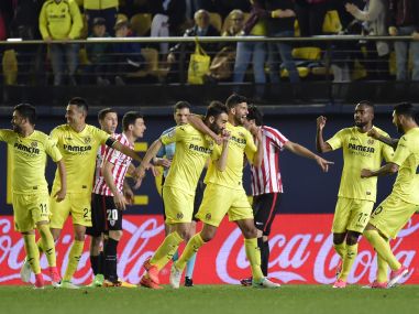 Villarreal's forward Adrian Lopez (C) celebrates a goal with teammates. AFP