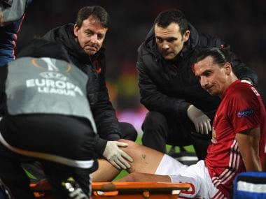 An injured Zlatan Ibrahimovic is given assistance during the Europa League quarter-final. Getty