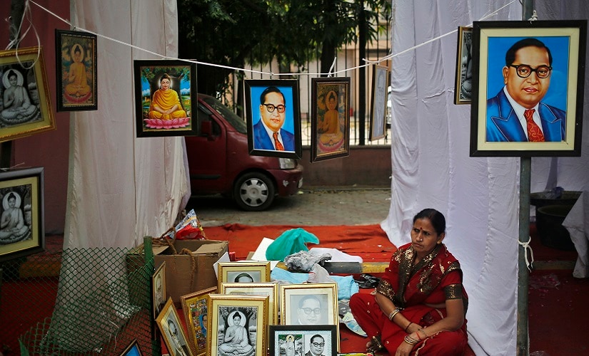 A vendor sells portraits of BR Ambedkar on a pavement in New Delhi. Reuters