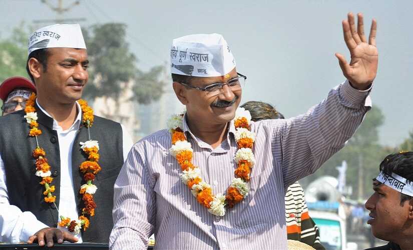 Faridabad : AAP convener Arvind Kejriwal during an election road show in Faridabad on Saturday. PTI Photo (PTI3_22_2014_000048A)