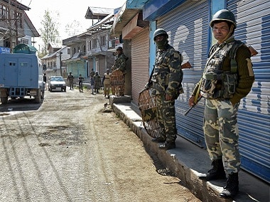 CRPF personnel maintain vigil during repolls in Srinagar Lok Sabha constituency in Budgam district of Kashmir on Thursday. PTI