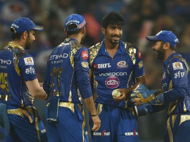 Jasprit Bumrah (facing camera) celebrates with MI teammates after taking an SRH wicket. AFP