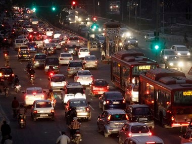Traffic moves along a busy road in New Delhi . Reuters