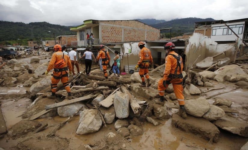 Rescuers search for survivors in Mocoa on 2 April. A grim search for the missing resumed at dawn Sunday in southern Colombia after surging rivers sent an avalanche of floodwaters, mud and debris through a city, killing at least 200 people and leaving many more injured and homeless. AP