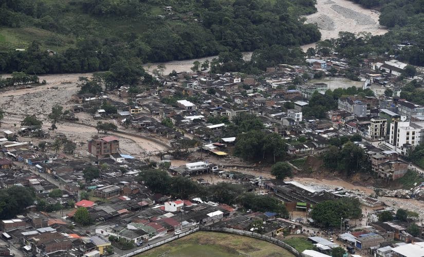 This handout photo released by the Colombia Presidential Press Office, shows an aerial view of a portion of Mocoa in Colombia after an avalanche of water from an overflowing river swept through the city as people slept. AP