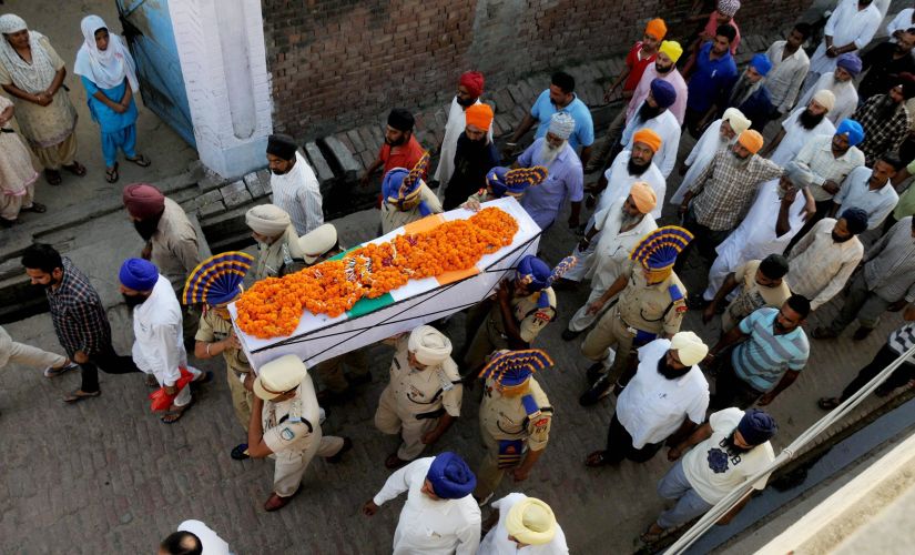 CRPF martyr Inspector Raghbir Singh being carried during his funeral in village Sathiala, 50 km from Amritsar on Tuesday. PTI