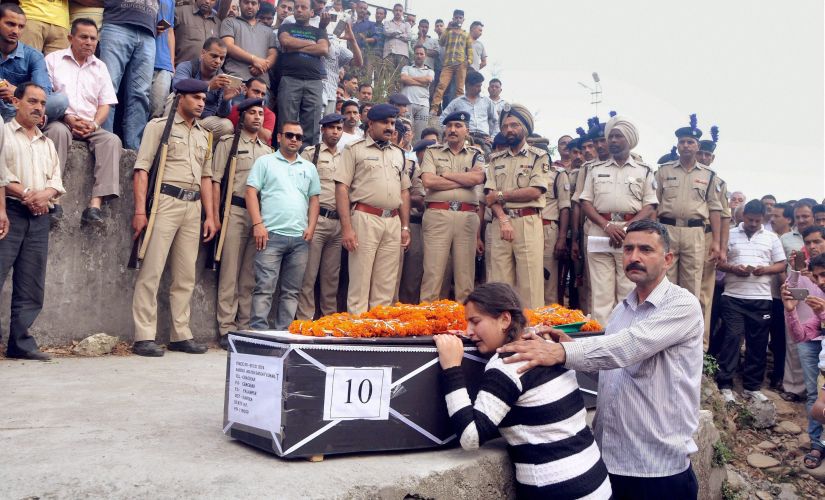 Daughter of a martyred CRPF jawan at his funeral in Dharamsala. PTI