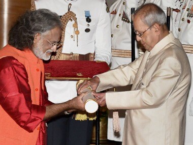 President Pranab Mukherjee felicitates Grammy Award-winner music maestro Pandit Vishwa Mohan Bhatt in New Delhi on Thursday. PTI