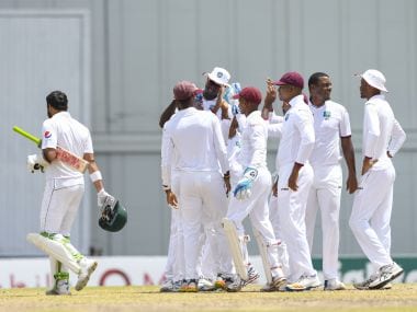 Shannon Gabriel (2R) of West Indies celebrates the dismissal of Azhar Ali (L) of Pakistan. AFP