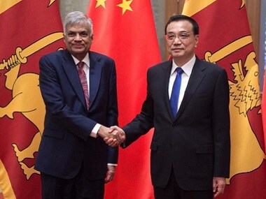 Sri Lankan Prime Minister Ranil Wickremesinghe (L) shakes hands with Chinese Premier Li Keqiang. Reuters