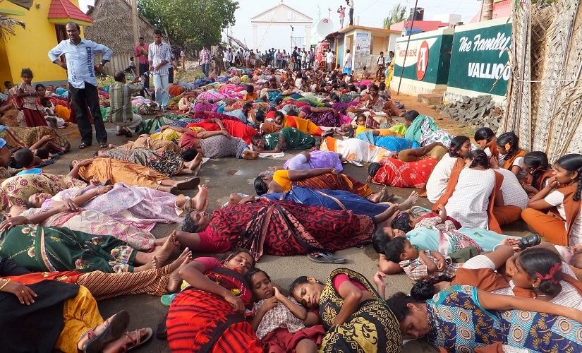 Demonstrators lie on a road during a protest near the Kudankulam nuclear power project. Reuters