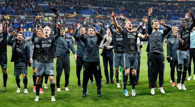 Ajax players celebrate after the match against Lyon. Reuters