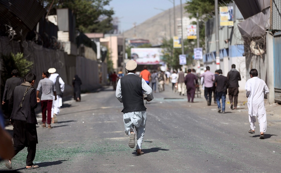 People run to the hospital near the site of a suicide attack in Kabul, Afghanistan. The ministry called on Kabul residents to donate blood, saying hospitals were in People run to the hospital near the site of a suicide attack in Kabul, Afghanistan. The ministry called on Kabul residents to donate blood, saying hospitals were in