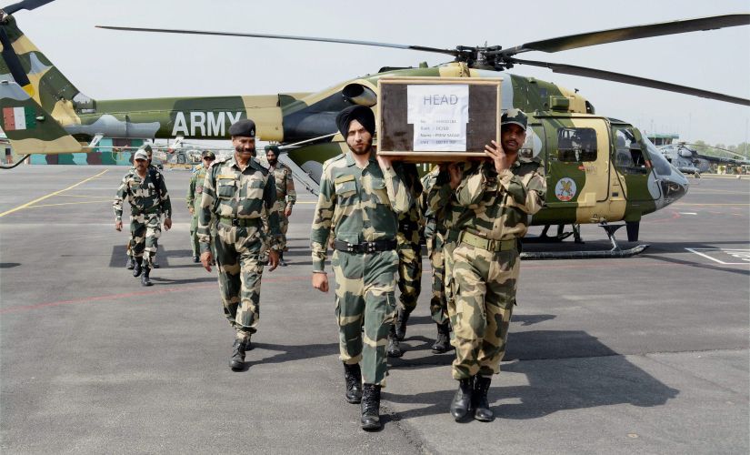 BSF jawans carry the coffin of head constable Prem Sagar, who lost his life in the ceasefire violation by Pakistan at LoC in Krishnagati sector of Poonch district in Jammu on Tuesday. PTI