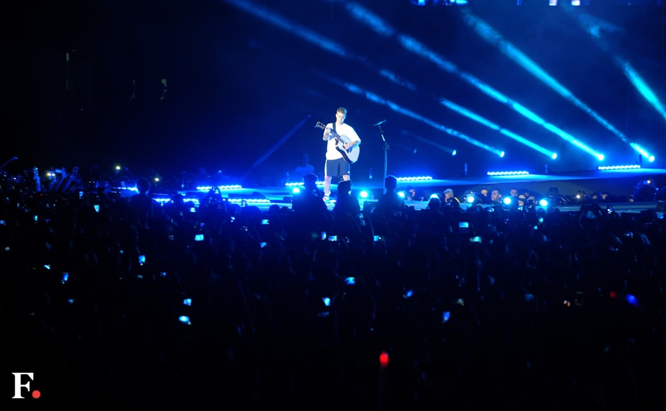 While Bieber lip-synced to a lot of his tracks, his acoustic renditions were the highlight of the evening. He even joked that his guitar had gone off tune because of the humidity in Mumbai — and proceeded to re-tune it right there on stage. Photos: Sachin Gokhale/Firstpost While Bieber lip-synced to a lot of his tracks, his acoustic renditions were the highlight of the evening. He even joked that his guitar had gone off tune because of the humidity in Mumbai — and proceeded to re-tune it right there on stage. Photos: Sachin Gokhale/Firstpost