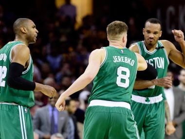 Avery Bradley celebrates with Jonas Jerebko of the Boston Celtics after their win over Cavaliers. Getty