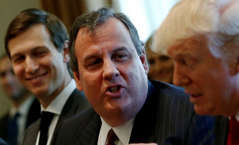 Chris Christie (centre) seen with Donald Trump (right). Reuters