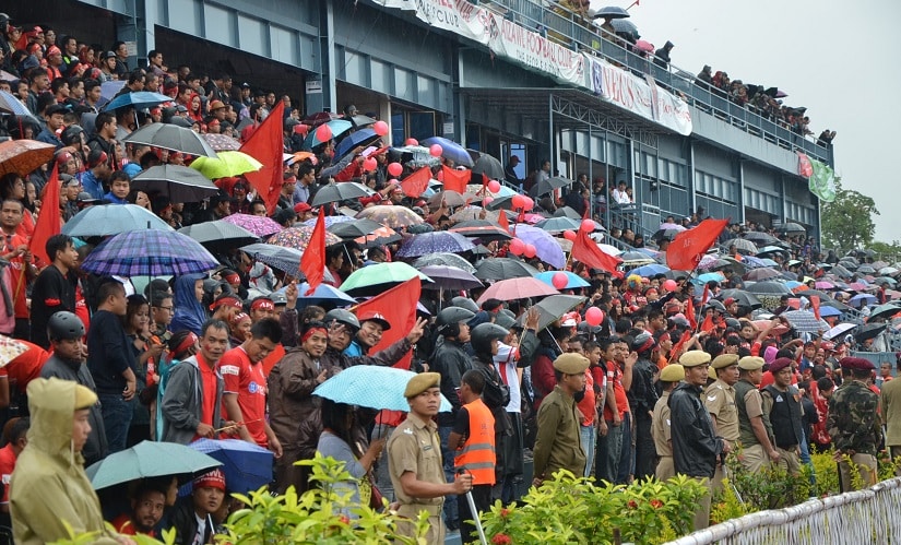 When Aizawl hosted Mohun Bagan, rain and mist made the viewing uncomfortable. But try telling that to these fans who packed the stadium in Aizawl. Image courtesy: AIFF media