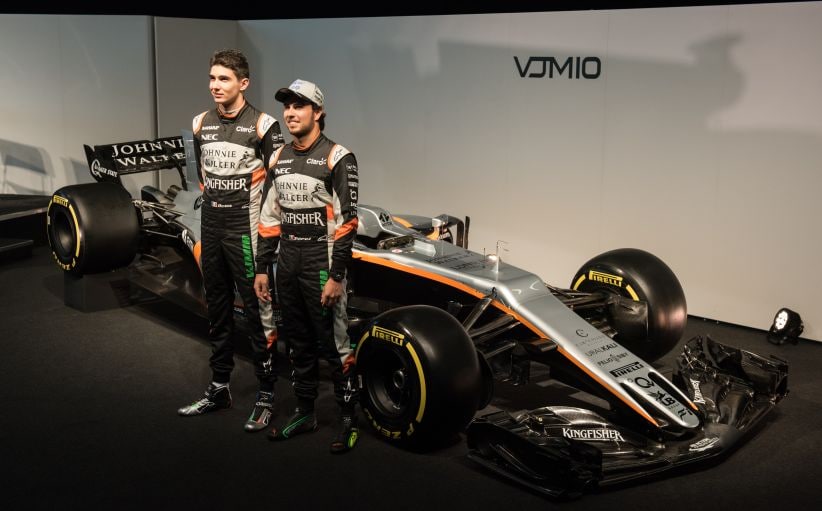 Sahara Force India's drivers Sergio Perez (R) and Esteban Ocon (L) during the launch of their 2017 car. AFP