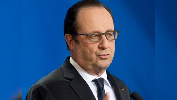 France's Francois Hollande greets Emmanuel Macron in first meeting since victory