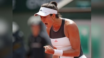 French Open 2017: Garbine Muguruza begins title defence with win, Caroline Wozniacki and Milos Raonic advance