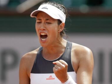 Garbine Muguruza clenches her fist after scoring a point against Anett Kontaveit. AP