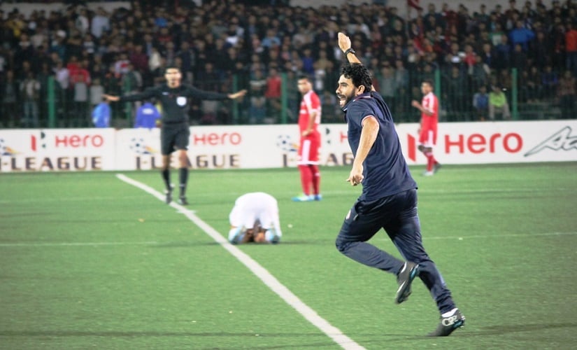 Aizawl FC coach Khalid Jamil runs on to the pitch after the final whistle in the game against Shillong Lajong. Image courtesy: AIFF media