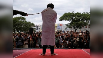 Indonesian men publicly caned for gay sex, defying Sharia law in Aceh province