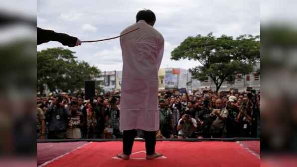 Indonesian men publicly caned for gay sex, defying Sharia law in Aceh province