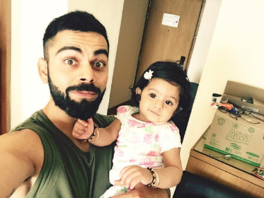 Virat Kohli shows softer side with Harbhajan Singh's daughter after MI-RCB match in IPL 2017 Virat Kohli shows softer side with Harbhajan Singh's daughter after MI-RCB match in IPL 2017