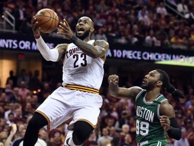 Cleveland Cavaliers' LeBron James (23) drives to the basket against Boston Celtics. Reuters