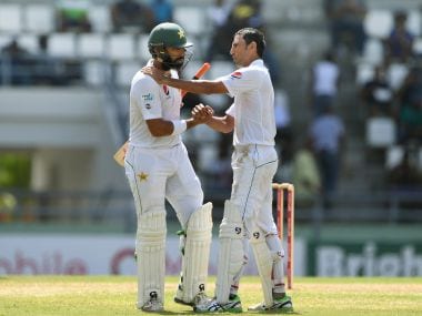 Pakistan captain Misbah-ul-Haq (left) is greeted by teammate Younis Khan on Saturday. AFP