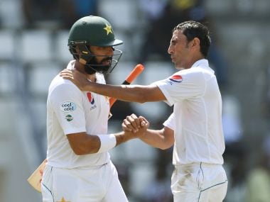 Pakistan captain Misbah-ul-Haq (L) is consoled by teammate and fellow retiree Younis Khan. AFP