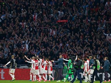 Ajax's players celebrate after the first leg semi final match between Ajax and Olympique Lyon. AP