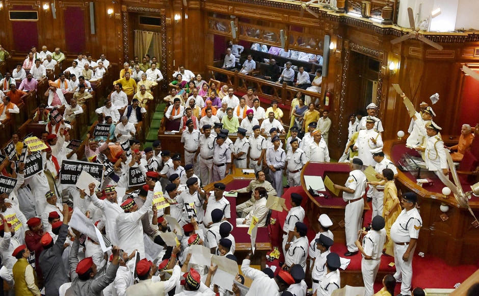MLAs from both the parties raised slogans and whistled during Governor Ram Naik's speech, even throwing paper balls at the Governor. Marshall's had to use paper files to shield the Governor as he was making his speech. <em>PTI</em> MLAs from both the parties raised slogans and whistled during Governor Ram Naik's speech, even throwing paper balls at the Governor. Marshall's had to use paper files to shield the Governor as he was making his speech. <em>PTI</em>