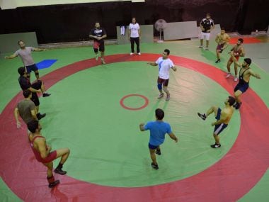 File photo of Pakistani wrestler Mohammad Inam (C) during a training session. AFP
