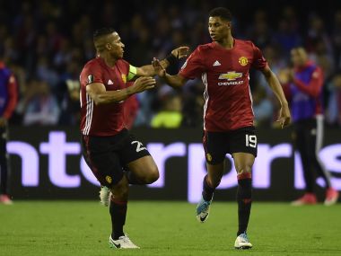 Manchester United's Marcus Rashford (right) celebrates his goal with Antonio Valencia. AFP