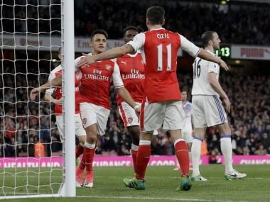 Arsenal's Alexis Sanchez, left, celebrates scoring his side's first goal with Mesut Ozil. AP