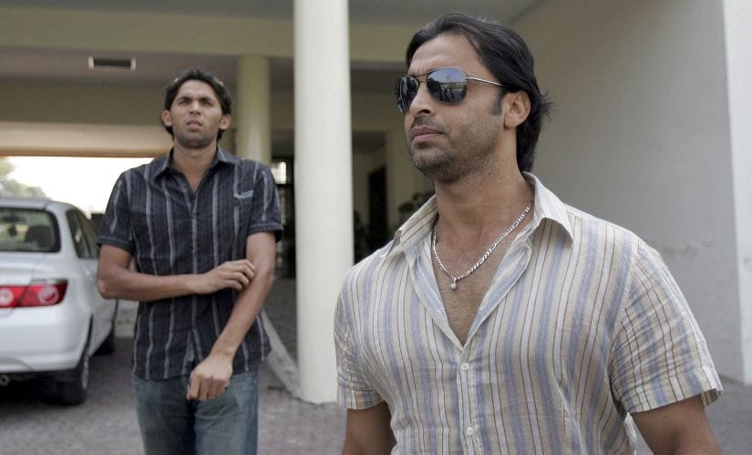 File image of Pakistan's fast bowlers Shoaib Akhtar (R) and Mohammad Asif leaving the PCB head office after facing the three-member Anti-Doping Tribunal. Reuters