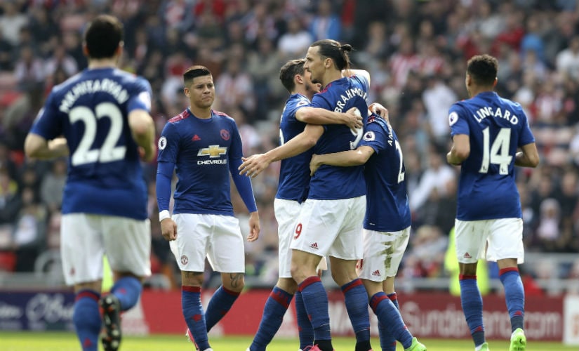 Manchester United players celebrate their win over Middlesbrough. AFP