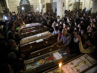 Relatives of the Coptic Christians who were killed during the attack surround their coffins. Getty Images