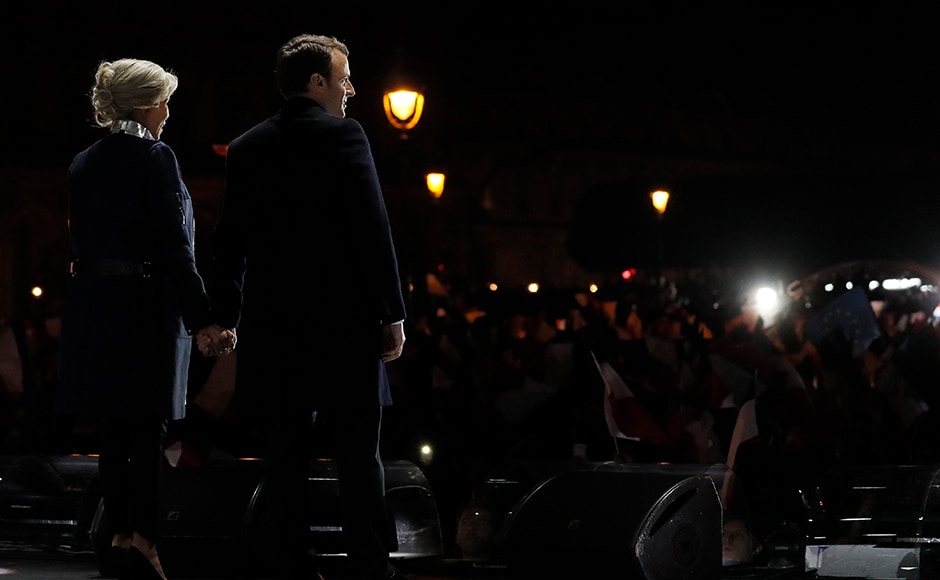 As the extent of his resounding victory sank in, Macron told a sea of jubilant supporters waving French flags outside the Louvre Museum in Paris, As the extent of his resounding victory sank in, Macron told a sea of jubilant supporters waving French flags outside the Louvre Museum in Paris,