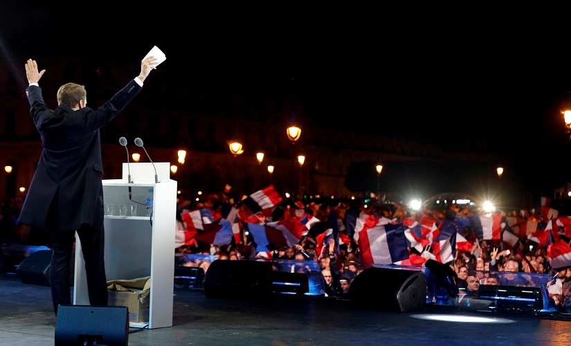 French president-elect Emmanuel Macron celebrates on stage at his victory rally near the Louvre. AP