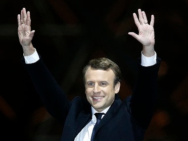 Emmanuel Macron gestures during a victory celebration outside the Louvre. AP