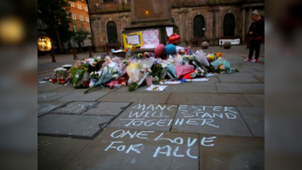 Manchester bomber photos released as marathon runners defy terror threat