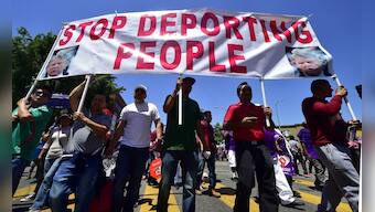 Cops declare riots in Portland during US May Day protests after 'anarchists' throw rocks, smoke bombs